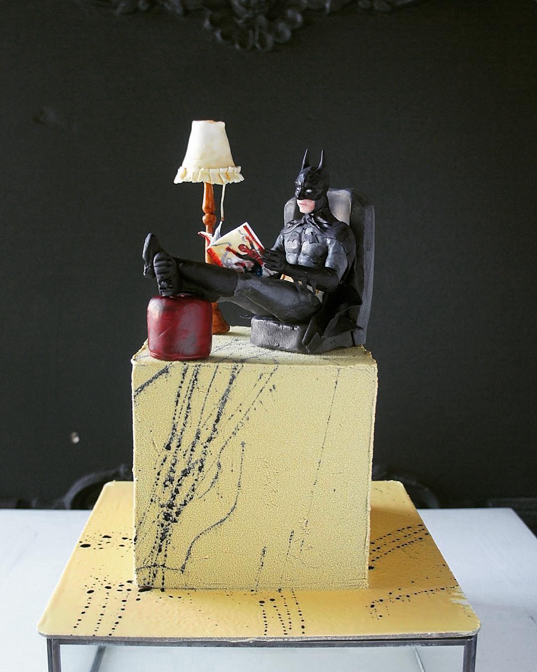 cake with batman reading comics