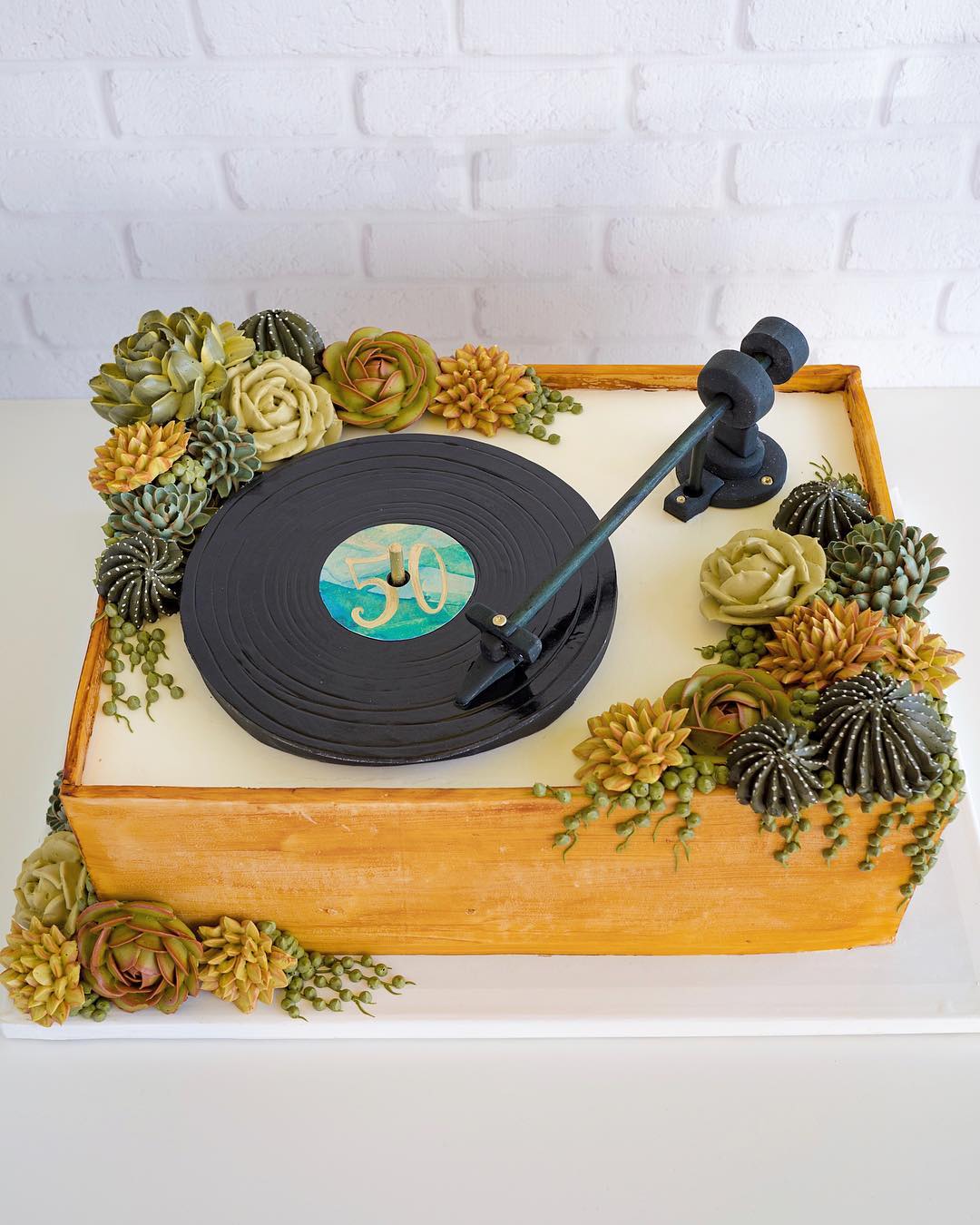 turntable cake with succulents