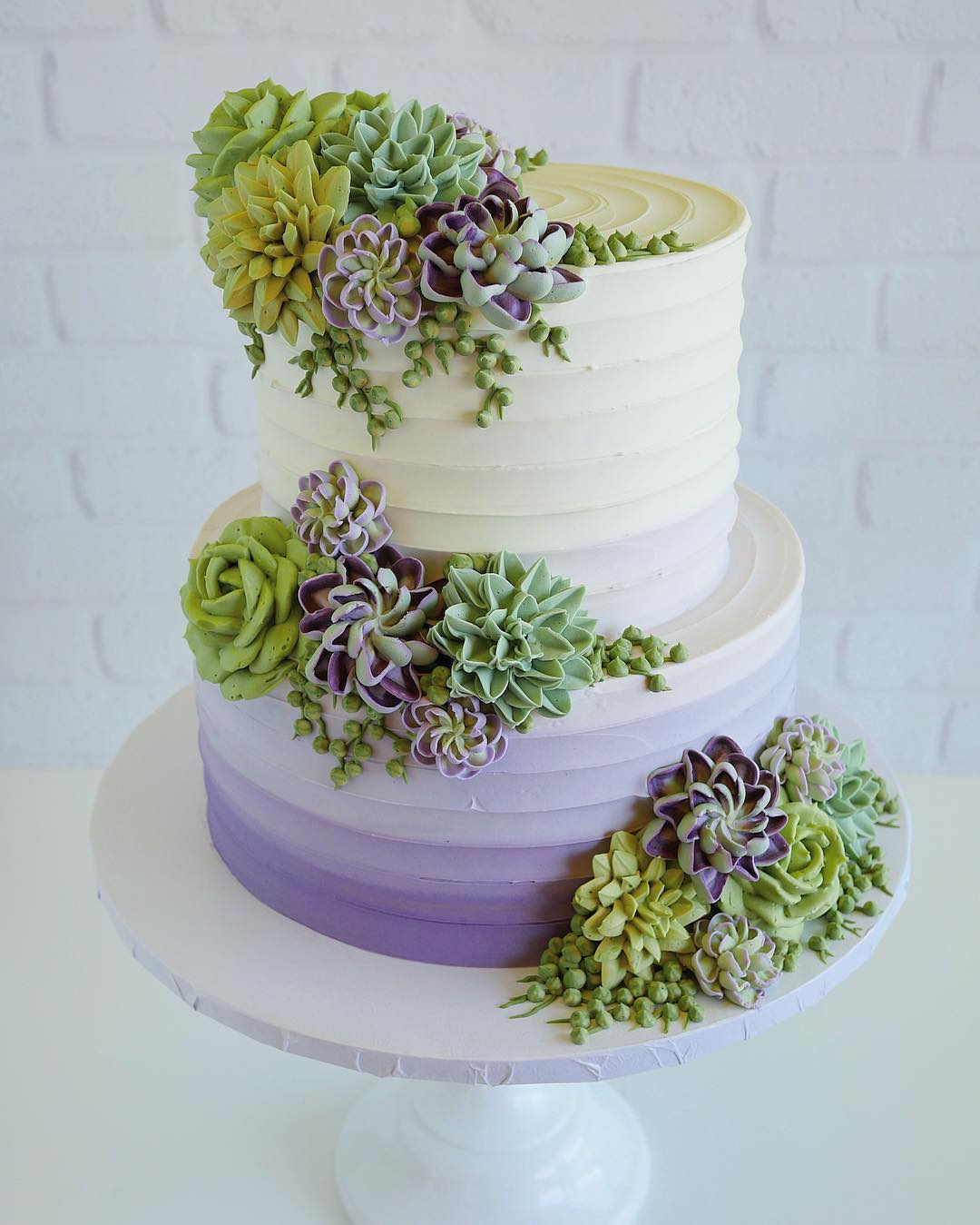 wedding cakes decorated with succulents