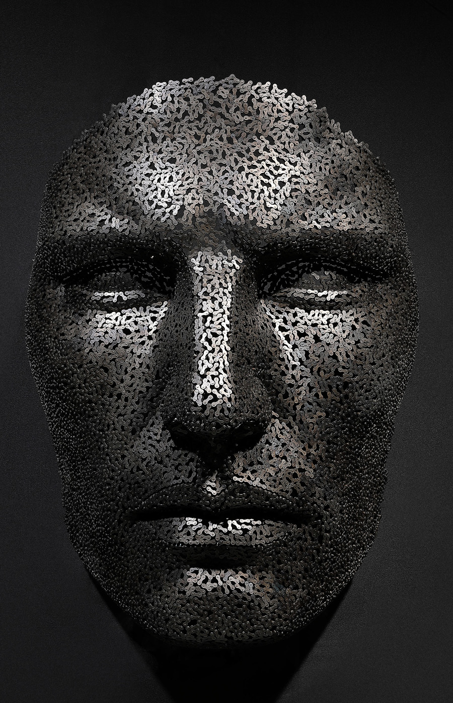 metal face sculpture