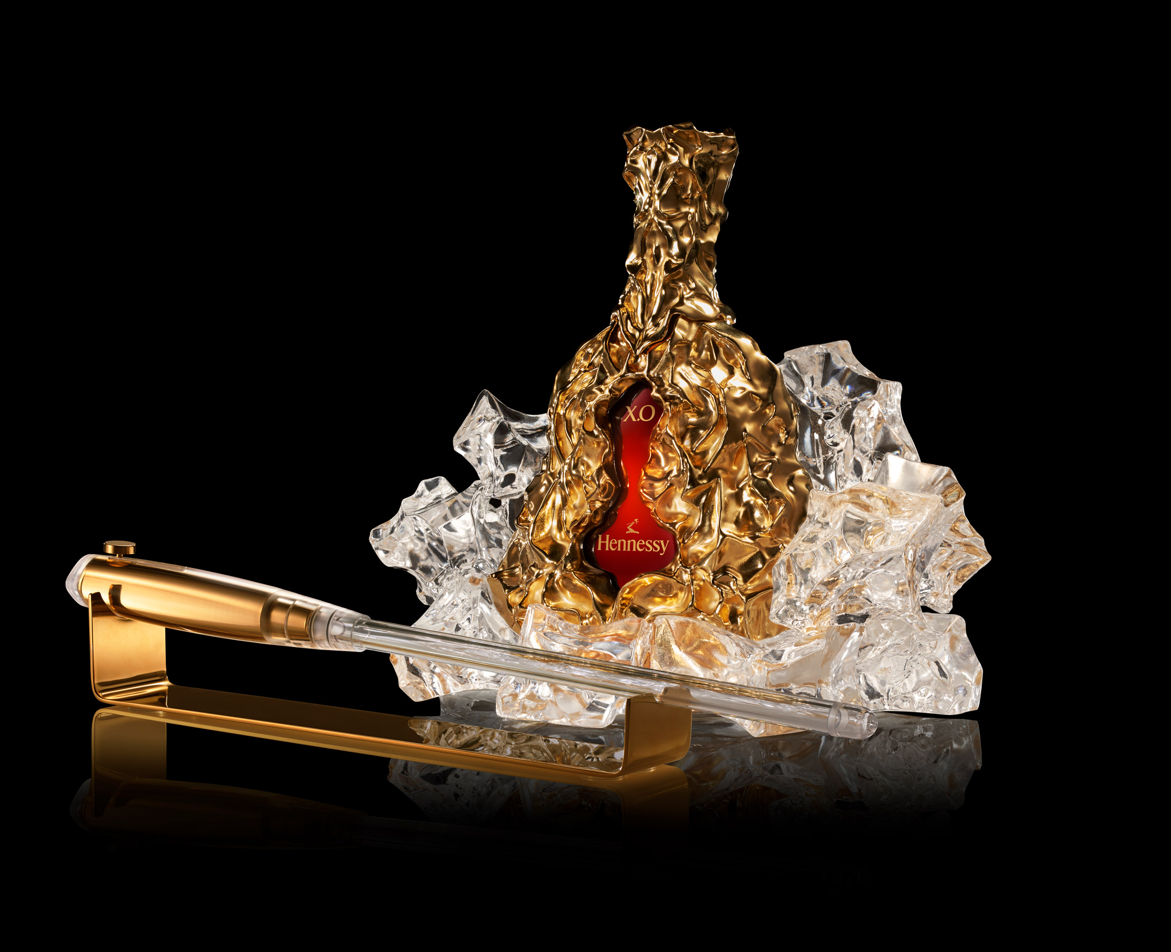 gold hennessy bottle with sculptural decanter