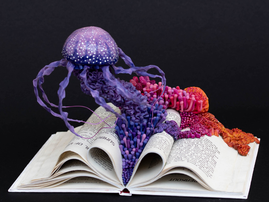 ecosystems of fungi and coral inhabit vintage books in Stéphanie Kilgast’s intricate sculptures