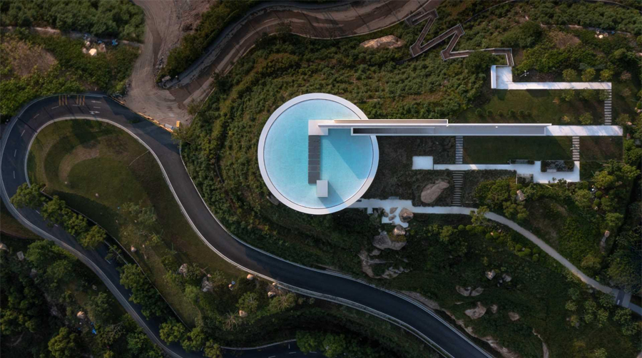 Clifftop Library in China with Circular Pool