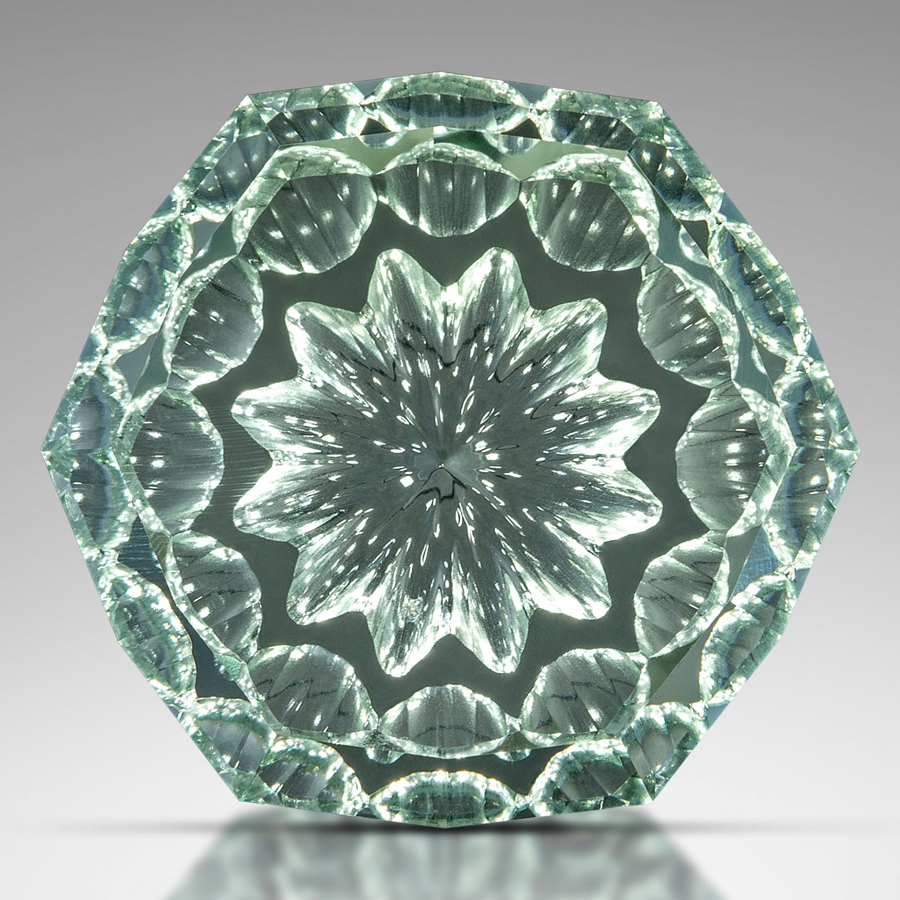 carved gemstone with patterns